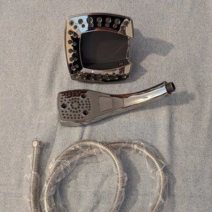 Delta chrome dual shower head with handheld sprayer built in, new in box.